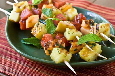 Fire pit grilled Fruit Skewers With Spicy Maple Cumin Glaze